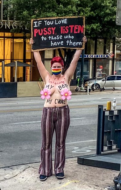 NSFW • “If You Love Pussy, Listen To Those Who Have Them,” Topless Woman Protests Abortion Ban At 6th & Congress Right Now